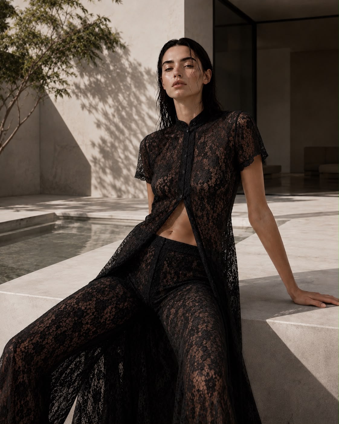 Black organic cotton lace cape top and wide-leg trousers set — sheer floral lace. PHAGE Paris